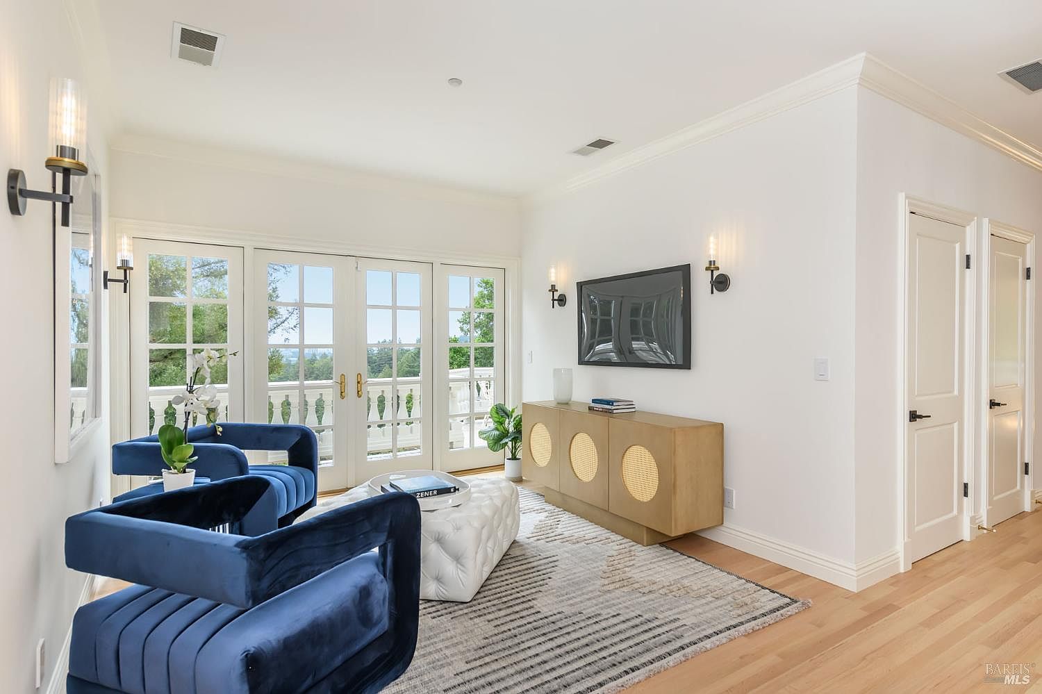 Sitting room with French doors framing Bay views